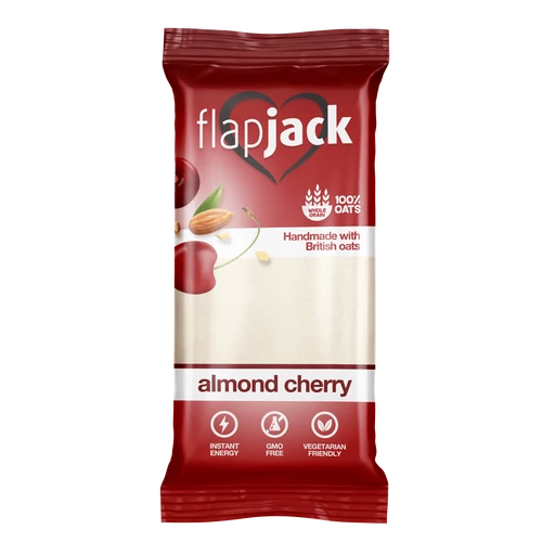 Flapjack Meggyízű mandulás zabszelet kandírozott cseresznyedarabokkal, fehér bevonóba mártva 100 g